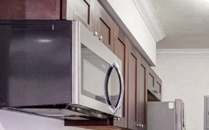 296 N. Oakland Apartments kitchen area with appliances, cabinets, and counters a kitchen with a stove refrigerator and a sink